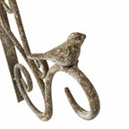 Decorative aged metal wall bracket with bird