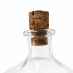 Bouteille ancienne en verre sur pied