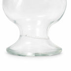 Bouteille ancienne en verre sur pied