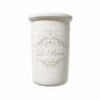 Pot à brosses à dents en céramique blanche avec inscription « Le Bain », style maison de charme.